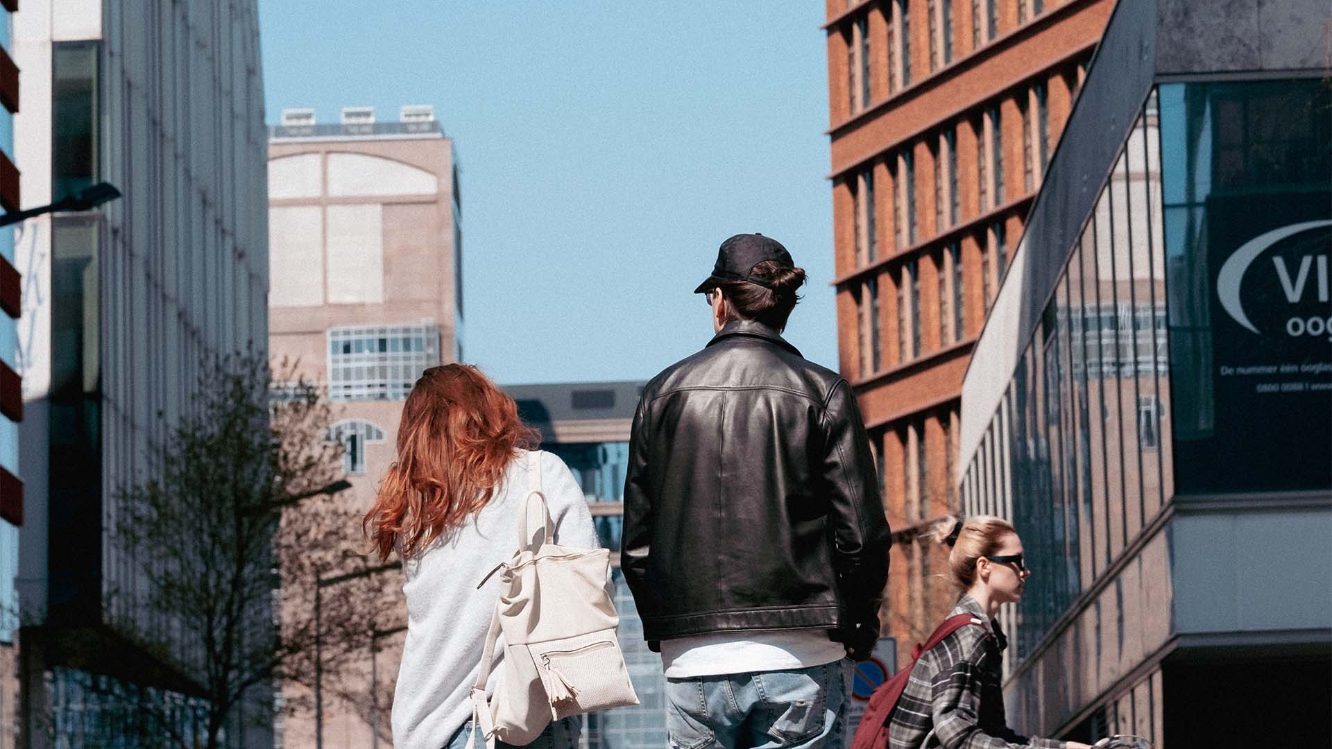 People walking together on downtown street.